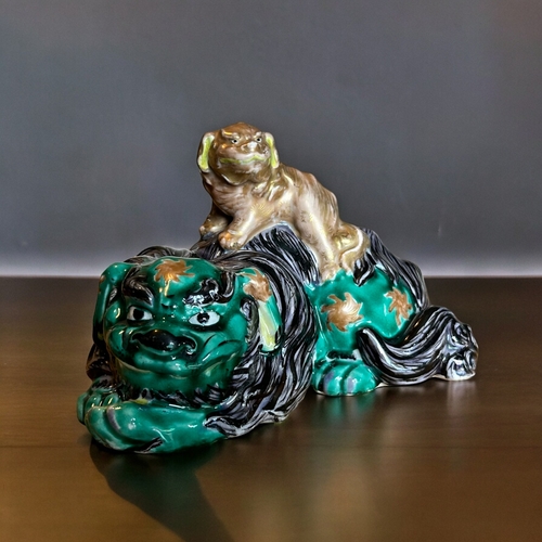 770 - A Japanese Kutani porcelain ShiShi Lion figure.Meiji period.Polychrome enamels painted Shi Shi mothe... 