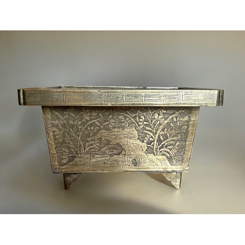 771 - A Chinese chased bronze planter.Late Qing / Republic period.Rectangular form, with chased outcrops t... 