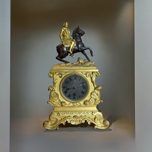 775 - A French Ormolu Bronze 'Napoleon' mantle clock.France, 19th century. Ormolu mounted Napoleon on pati... 