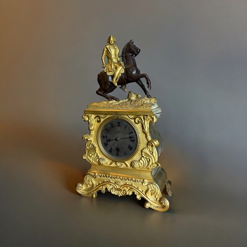 775 - A French Ormolu Bronze 'Napoleon' mantle clock.France, 19th century. Ormolu mounted Napoleon on pati... 