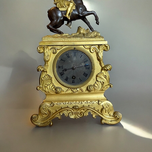 775 - A French Ormolu Bronze 'Napoleon' mantle clock.France, 19th century. Ormolu mounted Napoleon on pati... 