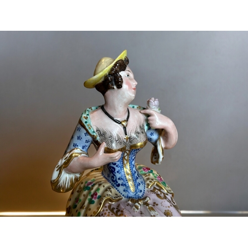 779 - A Jacob Petit porcelain penholder figure.Paris, 19th century.Polychrome painted. Marked to base.... 