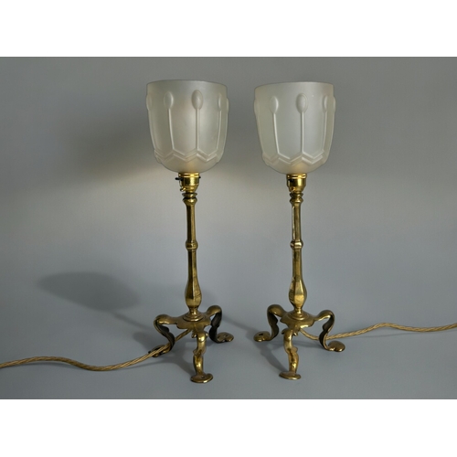 782 - A pair of Arts & Crafts brass table lamps.Unsigned, attributed to W.A.S Benson.With white glass ... 