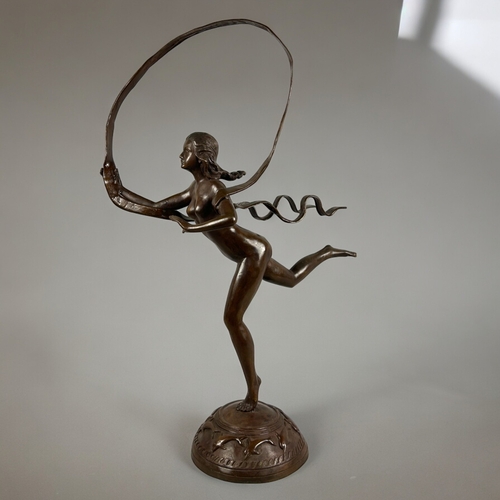 785 - A large Bronze 'Hoop' sculpture.After Paul Manship, American (1885 –1966).Height - 93cm