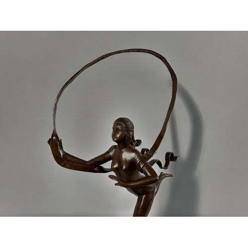 785 - A large Bronze 'Hoop' sculpture.After Paul Manship, American (1885 –1966).Height - 93cm