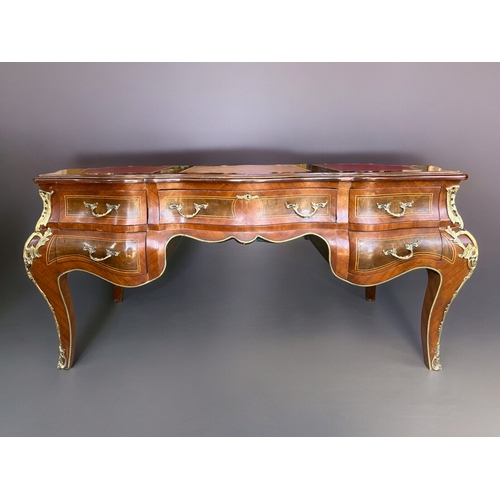 797 - A large French Empire style Bombe bureau plat / writing desk.Drawers to one side with dummy drawers ... 