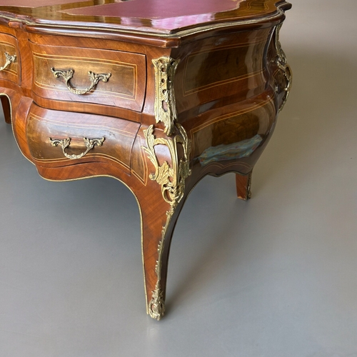 797 - A large French Empire style Bombe bureau plat / writing desk.Drawers to one side with dummy drawers ... 