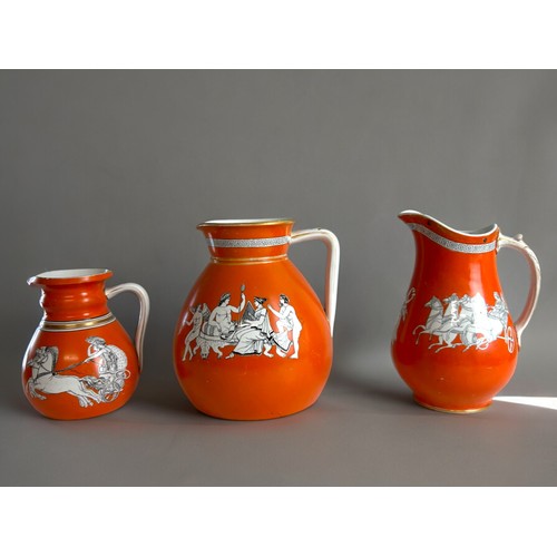 99 - Three 19th century 'Neo Classical' orange ground porcelain jugs. Including John Meir & sons and ... 