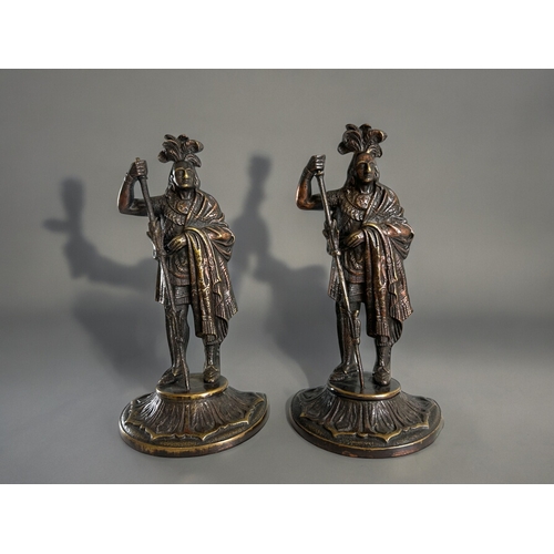 118 - A pair of cast brass Native American Indian figures.Height  - 23cm