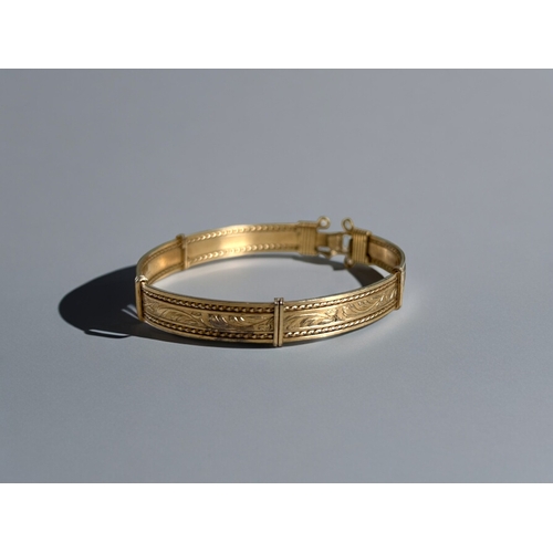 419 - A collection of gold plated jewellery. Including a child's 9ct metal core christening bangle, anothe... 