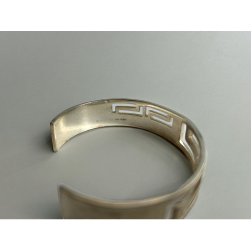 420 - A sterling silver 'Greek key' pattern cuff bracelet.