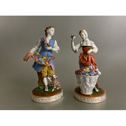 107 - A pair of Dresden hand painted porcelain figures.Depicting flower sellers.Height - 20cm