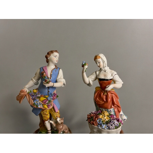 107 - A pair of Dresden hand painted porcelain figures.Depicting flower sellers.Height - 20cm