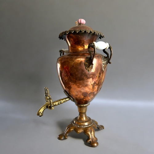 120 - A large Victorian Copper & Brass samovar.With ceramic handles and stylised brass tap.Height - 50... 