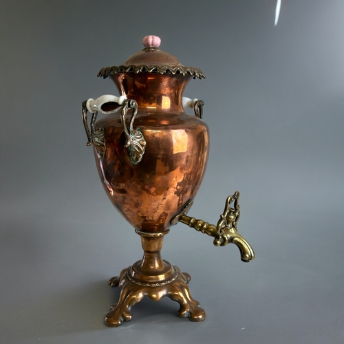 120 - A large Victorian Copper & Brass samovar.With ceramic handles and stylised brass tap.Height - 50... 