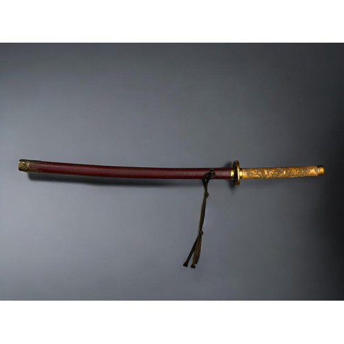 95 - A Reproduction Japanese Katana sword.With highly decorated bone style handle and metal Tsuba. Markin... 