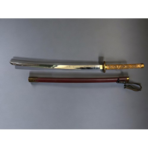 95 - A Reproduction Japanese Katana sword.With highly decorated bone style handle and metal Tsuba. Markin... 