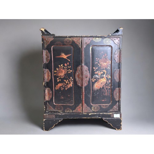 96 - A Japanese lacquer dresser cabinet.Meiji period.Twin doors open to reveal four drawers.37cm x 29cm x... 