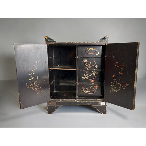 96 - A Japanese lacquer dresser cabinet.Meiji period.Twin doors open to reveal four drawers.37cm x 29cm x... 