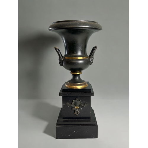 453 - A 19th century Grand Tour patinated garniture.Mounted on slate pillar.Height - 30cm