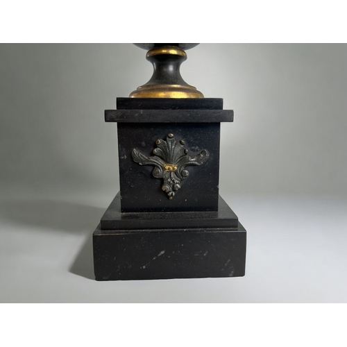 453 - A 19th century Grand Tour patinated garniture.Mounted on slate pillar.Height - 30cm