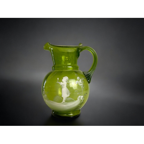 117 - A 19th century Mary Gregory style green glass jug.Height - 17cm