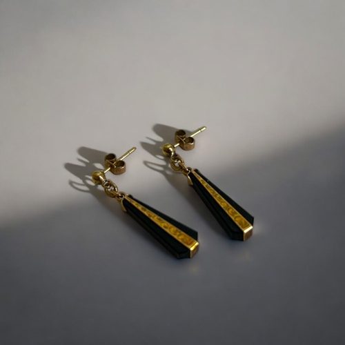 434 - A pair of 9ct gold & Onyx drop earrings.Engraved stylised design.Stamped 375 to earrings & B... 