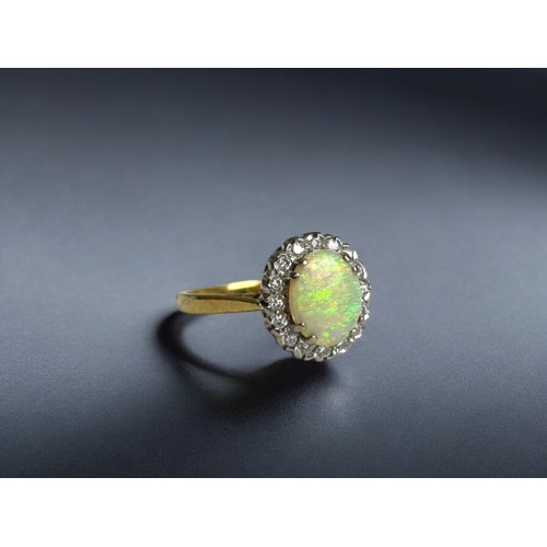 437 - A 9ct Gold, Opal & Diamond ring.Hallmarked.Size - M