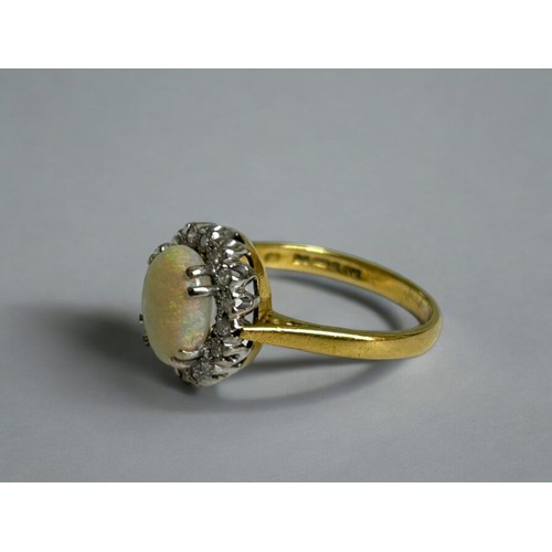 437 - A 9ct Gold, Opal & Diamond ring.Hallmarked.Size - M