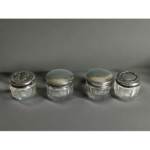 177 - A collection of antique silver lidded jars and scene bottle. Together with a silver plate decanter l... 