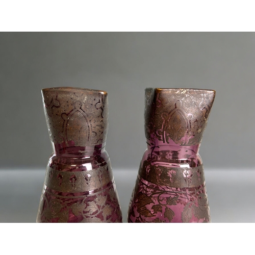 351 - A pair of large Victorian Amethyst glass vases.Overlaid stylised foliate designs. Height -27.5cm... 