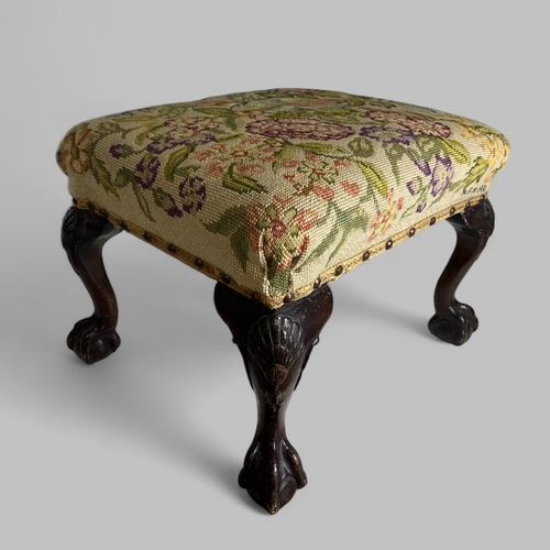 36 - A George III Walnut stool.Chippendale style. Carved 'Shell' design cabriole legs with ball & cla... 