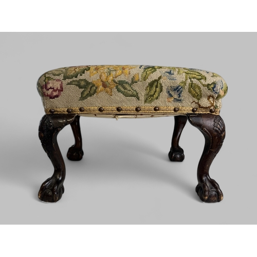 36 - A George III Walnut stool.Chippendale style. Carved 'Shell' design cabriole legs with ball & cla... 