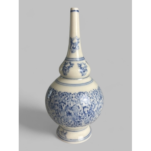 90 - A Chinese porcelain rose water sprinkler.Made for the Ottoman market. Hand painted scrolling foliate... 