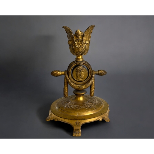 457 - A French Ferdinand Barbedienne gilt bronze watch holder & candlestick.19th century.Decorated wit... 