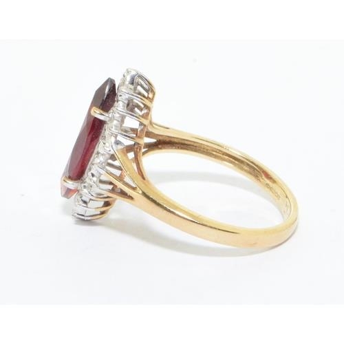 163 - 9ct gold ladies Ruby lozenge shape halo cocktail ring size N