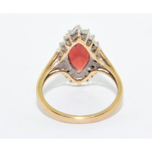 163 - 9ct gold ladies Ruby lozenge shape halo cocktail ring size N