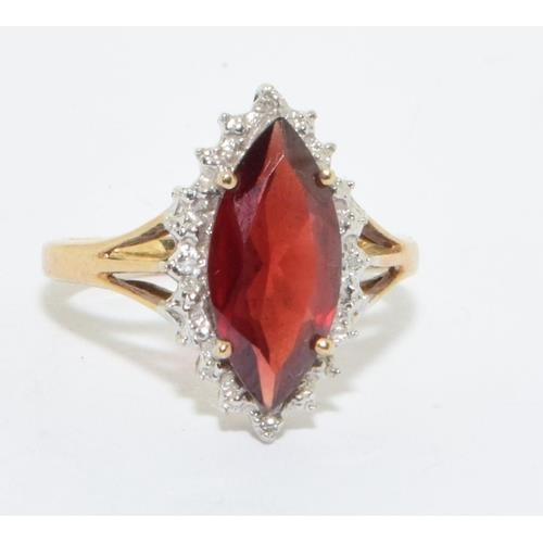 163 - 9ct gold ladies Ruby lozenge shape halo cocktail ring size N