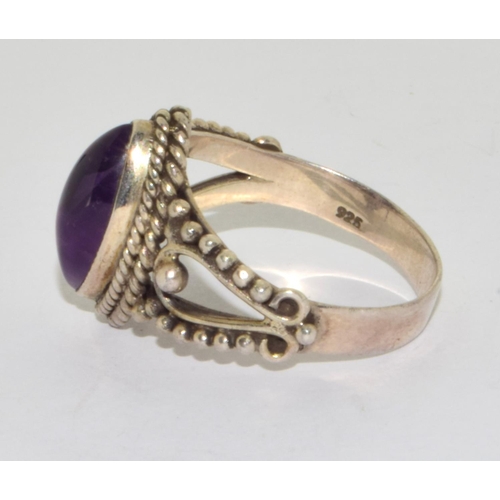 190 - 925 silver ladies cabochon diamond shape amethyst ring set on a twin shank design setting size S