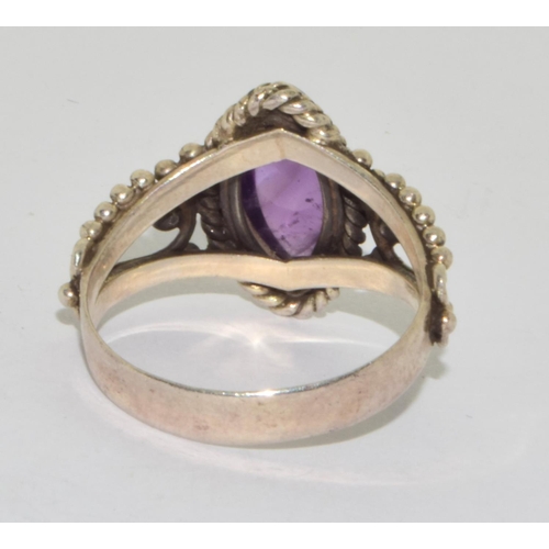 190 - 925 silver ladies cabochon diamond shape amethyst ring set on a twin shank design setting size S