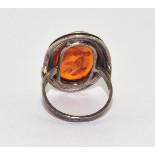 243 - 925 silver vintage Amber statement ring in an oval setting with scroll edging size O