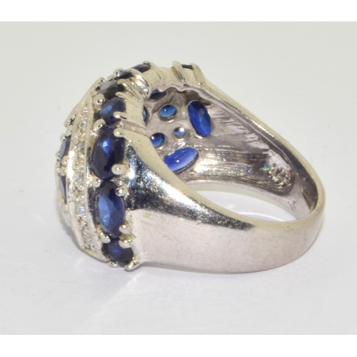 283 - 925 silver star design ring with blue stone decoration  size M