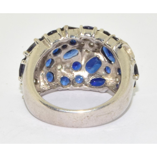 283 - 925 silver star design ring with blue stone decoration  size M