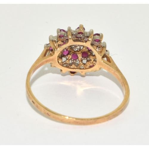 291 - Diamond and Ruby large style cluster Hall marked diamond in ring in 9ct gold size T