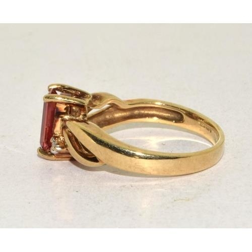 293 - 9ct gold ladies Diamond and Ruby coloured ring size N