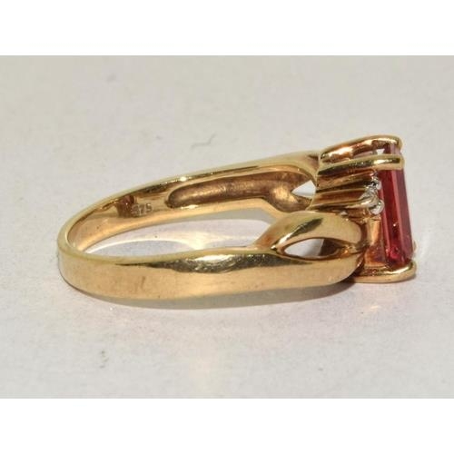 293 - 9ct gold ladies Diamond and Ruby coloured ring size N