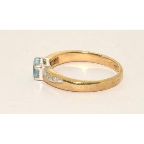 297 - 9ct gold ladies Aquamarine with Diamond shank ring size L