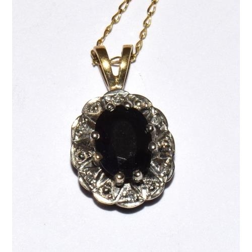 300 - 9ct gold Diamond and Sapphire pendant necklace together with matching earrings chain 42cm