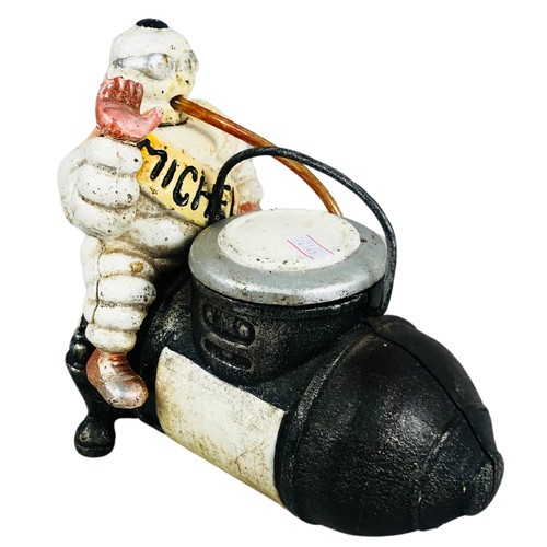 463 - Cast Iron Michelin Man Sat on a Bomb Dispenser.