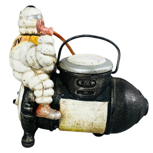 463 - Cast Iron Michelin Man Sat on a Bomb Dispenser.